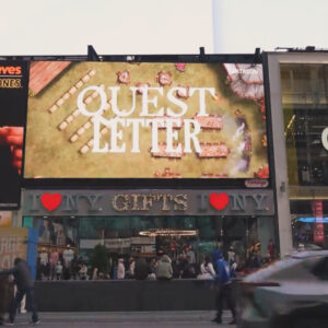 Quest Letter being featured on a bulletin board in time's square